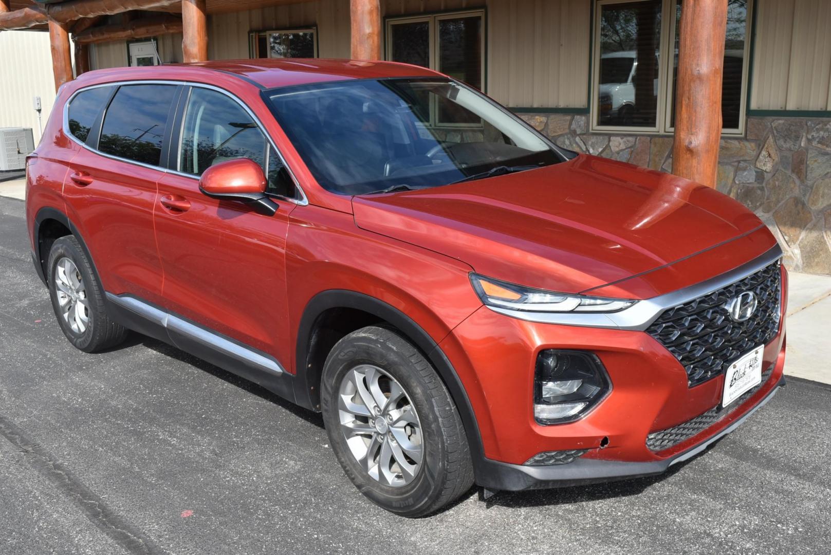 2020 Orange /Black Hyundai Santa Fe SE (5NMS2CAD7LH) with an 2.4L L4 DOHC 16V engine, 8-Speed Automatic w/ Overdrive transmission, located at 1600 E Hwy 44, Rapid City, SD, 57703, (605) 716-7878, 44.070232, -103.171410 - Photo#1