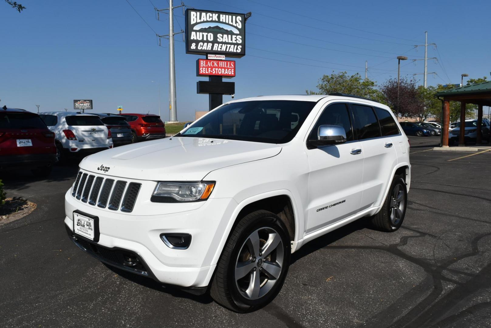 2015 White /Black Jeep Grand Cherokee Overland 4WD (1C4RJFCG8FC) with an 3.6L V6 DOHC 24V engine, 8-Speed Automatic transmission, located at 1600 E Hwy 44, Rapid City, SD, 57703, (605) 716-7878, 44.070232, -103.171410 - Photo#0