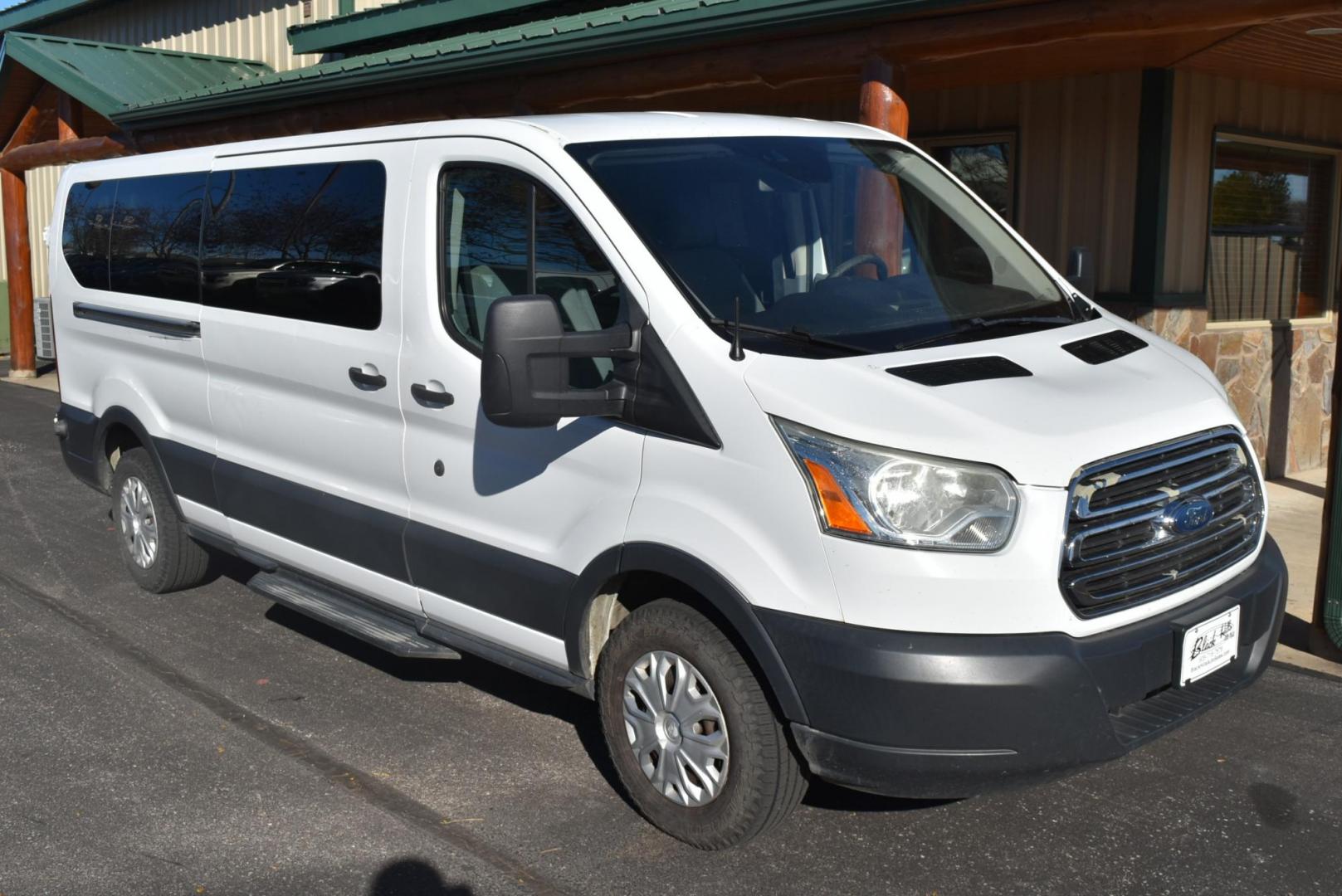 2016 White /Dark Gray Ford Transit 350 Wagon Low Roof XLT w/Sliding Pass. 148-in. WB (1FBZX2YG2GK) with an 3.5L ECOBOOST V6 engine, 6-Speed Automatic w/OD & Selectshift transmission, located at 1600 E Hwy 44, Rapid City, SD, 57703, (605) 716-7878, 44.070232, -103.171410 - Photo#1