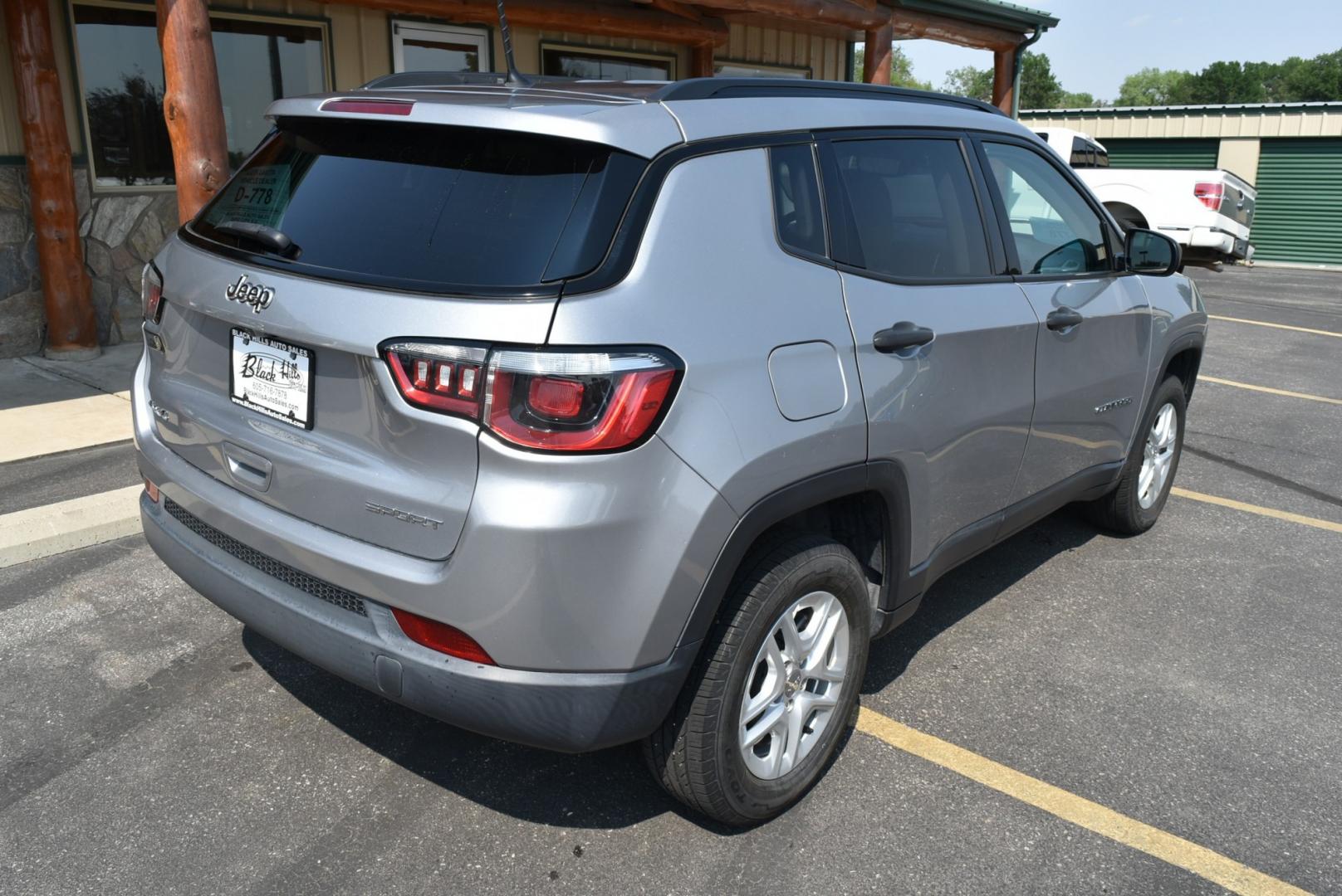 2018 Gray /TAN Jeep Compass Sport (3C4NJDAB9JT) with an 2.4L 4 Cyl MultiAir engine, 9-Speed Automatic transmission, located at 1600 E Hwy 44, Rapid City, SD, 57703, (605) 716-7878, 44.070232, -103.171410- Photo#8