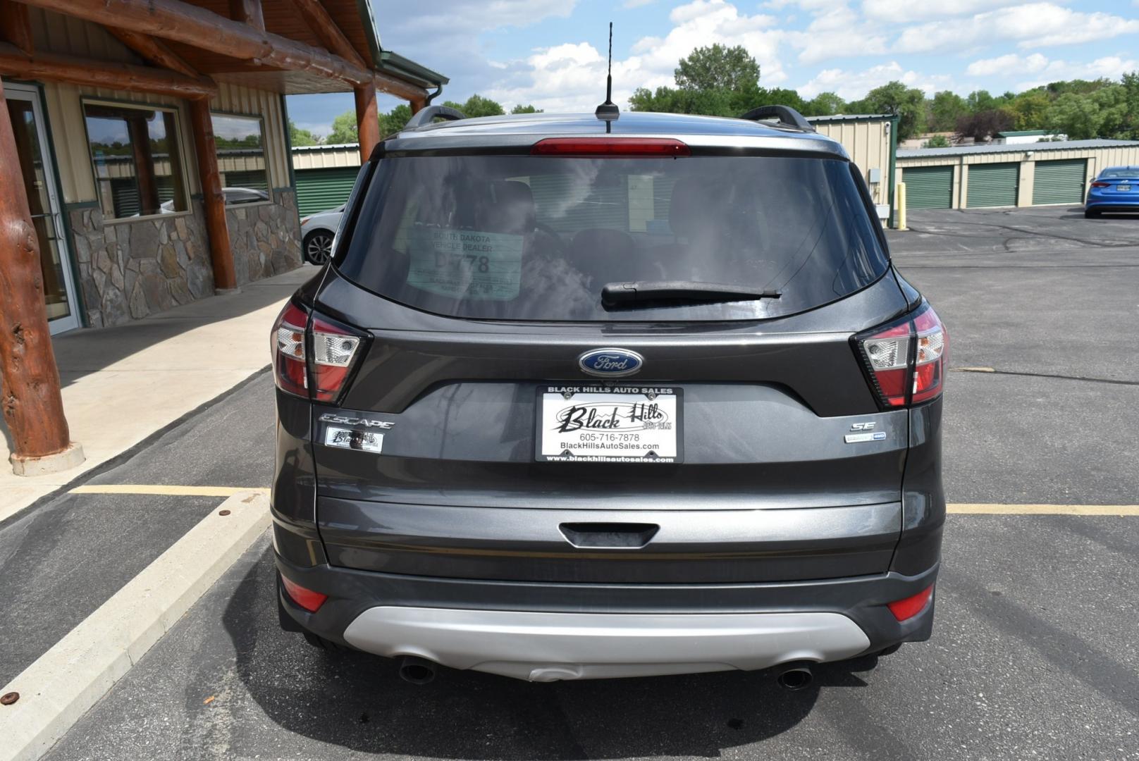 2018 Gray Ford Escape SE (1FMCU9GD6JU) with an 1.5L 4 Cyl Ecoboost engine, 6-Speed Automatic transmission, located at 1600 E Hwy 44, Rapid City, SD, 57703, (605) 716-7878, 44.070232, -103.171410- Photo#2