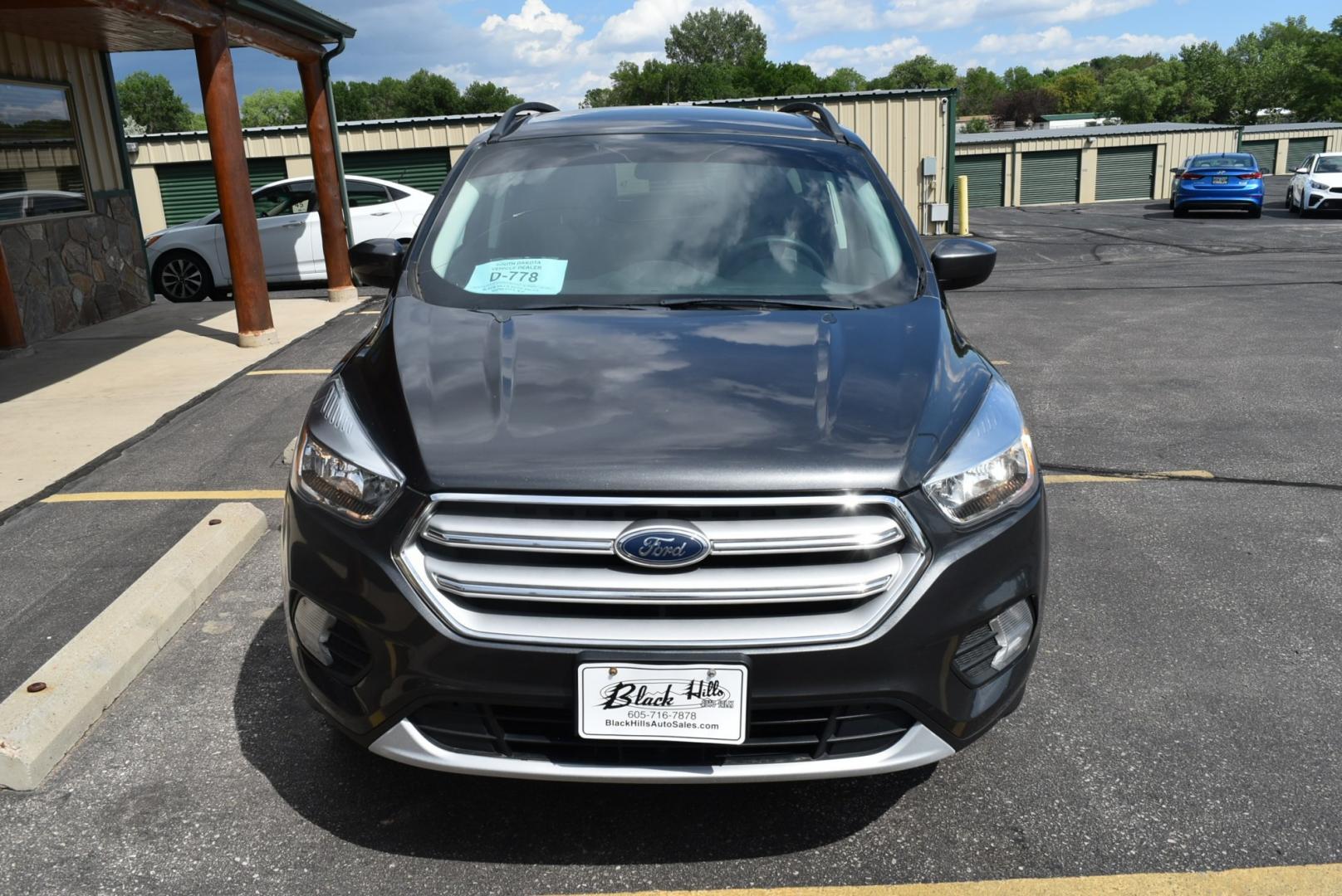 2018 Gray Ford Escape SE (1FMCU9GD6JU) with an 1.5L 4 Cyl Ecoboost engine, 6-Speed Automatic transmission, located at 1600 E Hwy 44, Rapid City, SD, 57703, (605) 716-7878, 44.070232, -103.171410- Photo#6