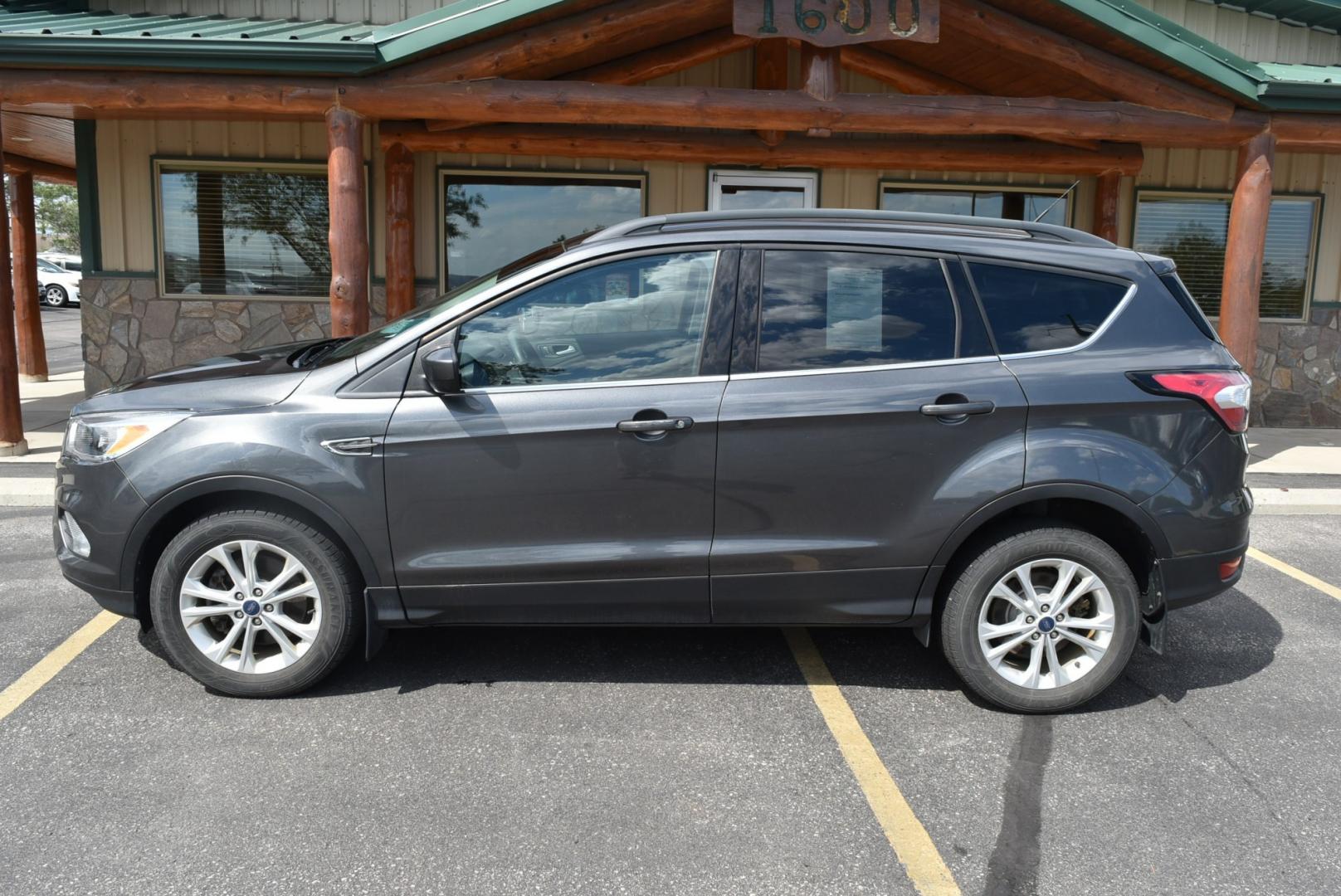 2018 Gray Ford Escape SE (1FMCU9GD6JU) with an 1.5L 4 Cyl Ecoboost engine, 6-Speed Automatic transmission, located at 1600 E Hwy 44, Rapid City, SD, 57703, (605) 716-7878, 44.070232, -103.171410- Photo#4