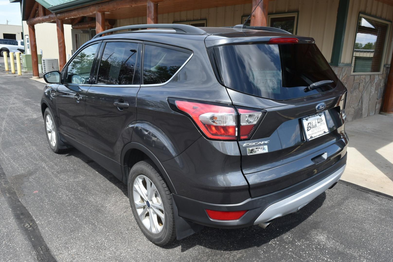 2018 Gray Ford Escape SE (1FMCU9GD6JU) with an 1.5L 4 Cyl Ecoboost engine, 6-Speed Automatic transmission, located at 1600 E Hwy 44, Rapid City, SD, 57703, (605) 716-7878, 44.070232, -103.171410- Photo#8